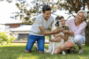 Family members playing with their dog and enjoying their poop free lawn in Denver, Colorado.