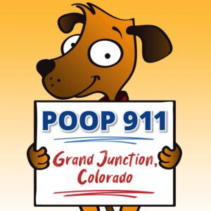 A happy brown dog holding up a POOP 911 Grand Junction pooper scooper service yard sign.